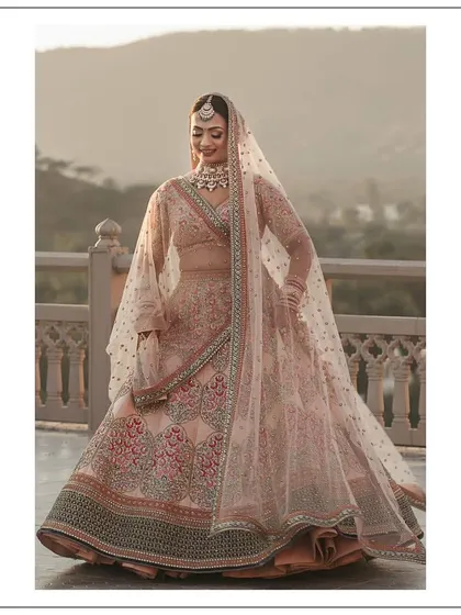 A closer look at Somya's wedding lehenga. The delicate net dupatta with scattered motifs and the detailed craftsmanship on the skirt came together to create a look of pure elegance. It was a joy to help her find an outfit that made her feel so radiant.