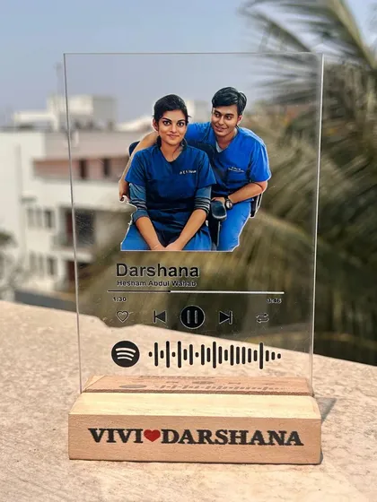 A perfect gift for a couple in the medical profession. This Spotify plaque features their photo in their scrubs, their names engraved on the wooden base, and the code to their special song.