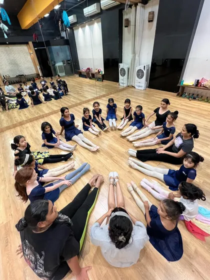 A circle of trust and friendship. Our students and teachers stretching together before class.