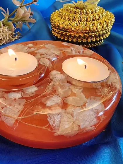 A closer look at the orange floral tealight holder.