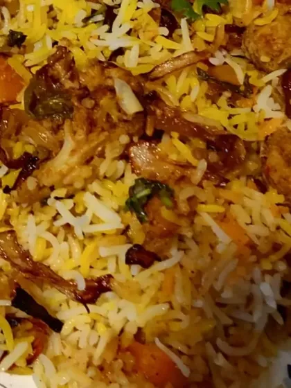 My Veg Dum Biryani is layered with fresh vegetables, fragrant basmati rice, and aromatic spices. It is slow-cooked on dum to ensure every grain is infused with flavor, making it a centerpiece for any vegetarian feast.