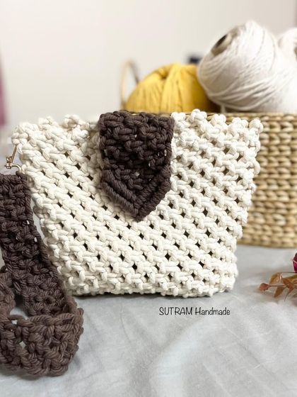 This off-white and brown sling bag is one of my favorites. You can see it here with some of my cotton threads in the background, right from my studio.