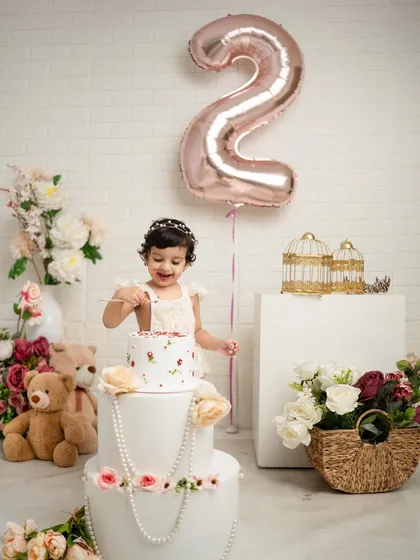 The moment she finally gets to taste the cake. Capturing these key moments of a second birthday celebration is what I do best.
