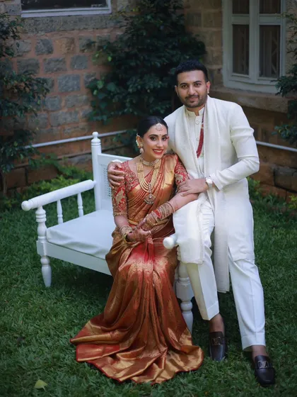 A timeless South Indian couple portrait. I created a classic bridal makeup look to complement her stunning red and gold Kanchivaram saree. The focus was on elegant, traditional features with a bold lip, perfect for a muhurtham ceremony.