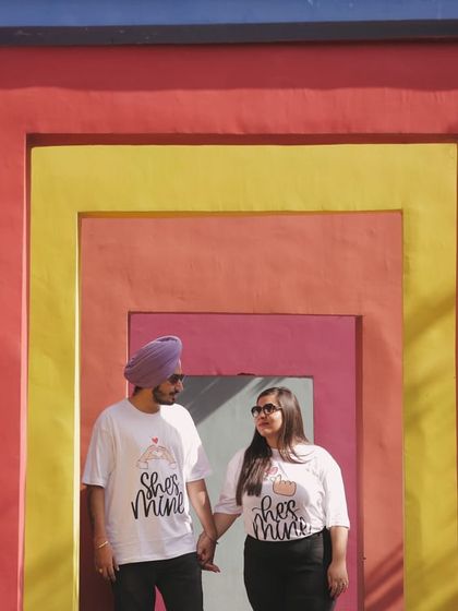 Our colorful geometric wall offers a vibrant and modern background for your couple's photoshoot. The interlocking shapes and bright colors create a playful and artistic setting for your pictures.