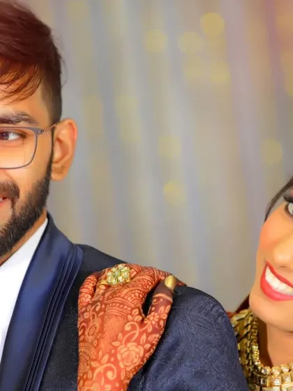 A candid, happy moment between the bride and groom during their wedding reception.