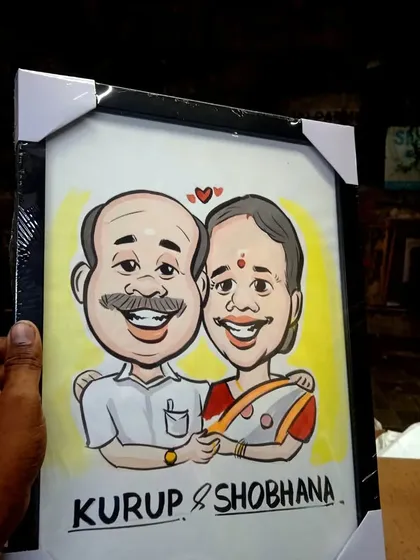 The finished product, a colorful couple's caricature, professionally framed and ready to be displayed. I offer framing options to make gifting even easier.