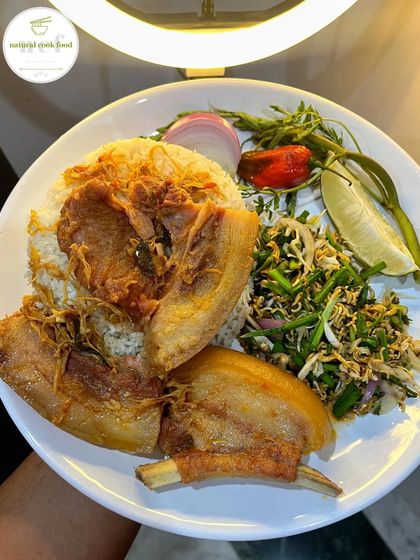 Simple and delicious. This plate has fried pork ribs and a fresh chive salad (maroi nakuppi singju) served with steamed rice.