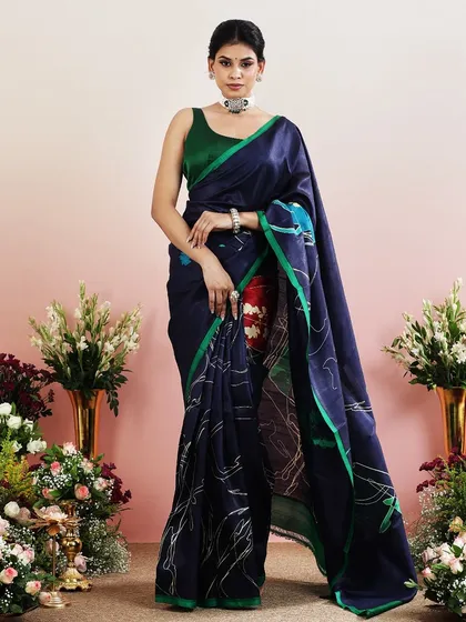 The full view of the navy and green printed saree, a modern and chic choice.