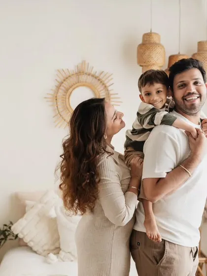 Capturing the fun and energy of a family with a toddler. This lifestyle shot in my boho studio setup shows a happy moment between parents and their three-year-old.