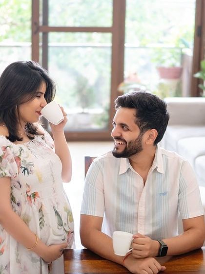 An at-home maternity session, capturing the couple enjoying a simple, everyday moment together before the baby arrives.