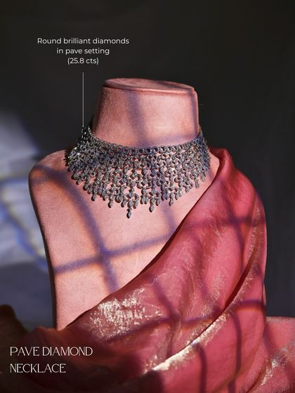 The Pave Diamond Necklace on a bust, showcasing its impressive scale and intricate design. It is crafted with 25.8 carats of round brilliant diamonds in an elegant pave setting.