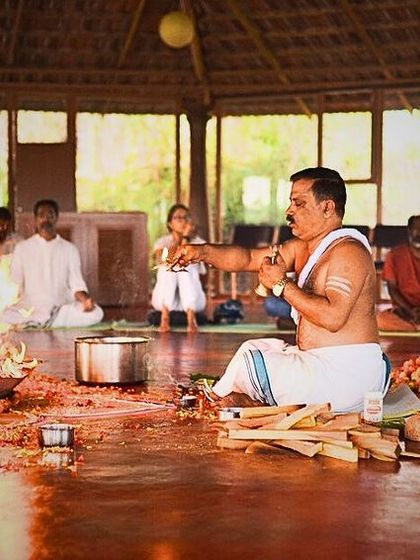 A priest performs the sacred rituals of a Puja ceremony. We begin every teacher training with this traditional practice to honor the lineage of yoga and invoke blessings for a fruitful and transformative experience.