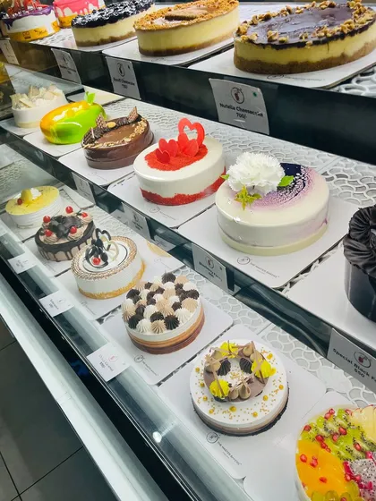 Our cake display is always stocked with beautiful and delicious options, from large cheesecakes to mini celebration cakes in a variety of flavors and designs.
