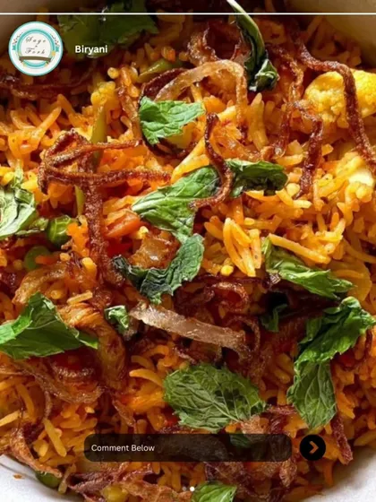 A close-up of my aromatic Veg Biryani. It's cooked with long-grain basmati rice, a mix of fresh vegetables, and fragrant spices, then garnished with crispy fried onions and fresh mint.