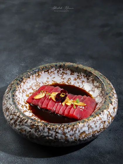 Tuna Sashimi with a ponzu dressing, elegantly plated in a stone bowl for the Zarin menu at Fairmont Jaipur.
