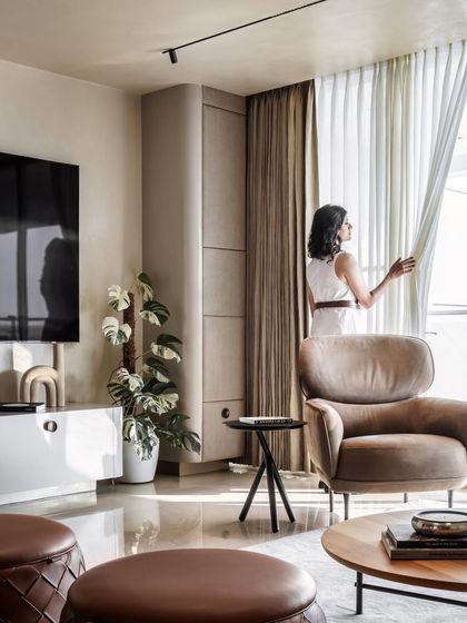 Natural light floods the living space, highlighting the clean lines and refined details. The design of this penthouse was driven by the clients' desire for a tranquil retreat, a space that radiates calm and invites relaxation away from the city's hustle.