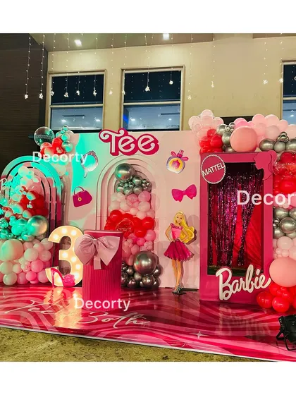The Barbie party stage illuminated at night, creating a glamorous and exciting atmosphere.