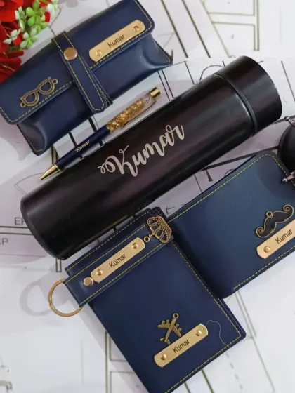 This matching navy blue set is one of my most popular combos. It comes with a personalized wallet, passport holder, keychain, and eyewear case, all featuring his name and a selection of cool charms like a mustache or an airplane.