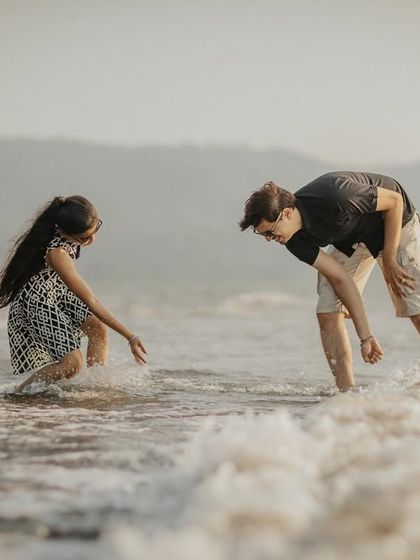 Capturing a playful moment in the water. These candid shots add a sense of fun and spontaneity to your pre-wedding album.