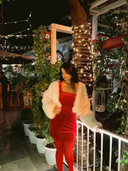 Another shot of my Christmas look. The fairy lights and festive decor at the cafe made the perfect backdrop for this outfit.