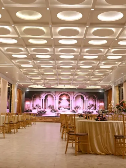 This is another one of my luxury banquet halls in Vashi, featuring a modern ceiling and elegant round table seating. It's a pillarless hall, so every guest gets a perfect view of the stage, and it can easily accommodate up to 700 people.