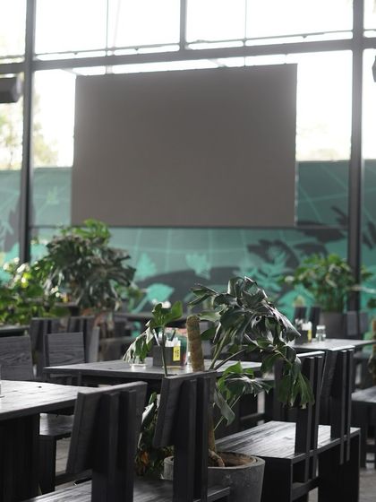 The view from the back of the dining hall, looking out into the lush greenery.
