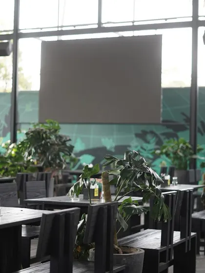 The view from the back of the dining hall, looking out into the lush greenery.