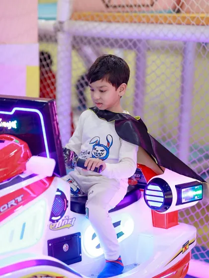 Every hero needs a cool ride. This little Batman is ready to save Gotham City on one of our arcade-style bikes.