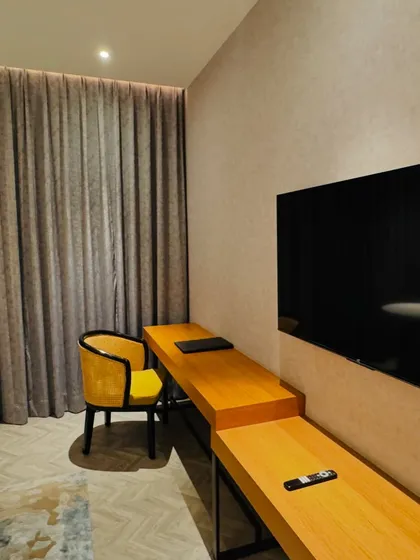 A look at the workspace and entertainment setup in a guest room. We consider all aspects of the room, including the desk, chair, and television.