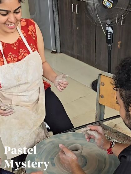 Our instructors are always on hand to help. Here, we are guiding a guest through the initial steps of shaping his pot, ensuring a fun and stress-free learning environment for everyone.