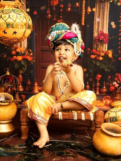 A toddler enjoying a snack during his Little Krishna photoshoot. I always allow for breaks and candid moments to keep the kids happy.