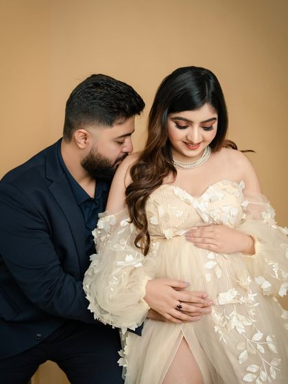 A shared secret. This pose, with the partner leaning in close, creates an intimate and romantic portrait of the couple's shared journey.