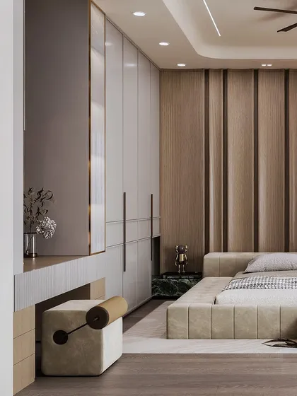 This view shows the integrated vanity and wardrobe, with a focus on the clean lines and the contrast of wood and green marble.