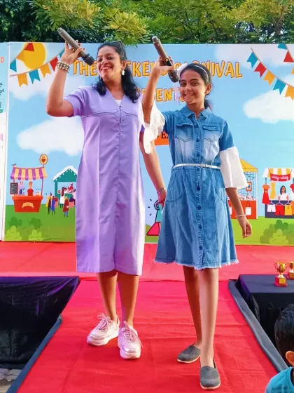 Sharing the stage and the mic with a confident young performer at The Weekend Carnival. I believe in empowering the next generation, and I love giving them a moment to shine at my events.