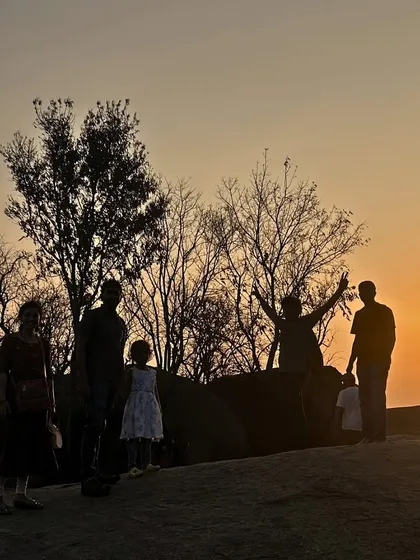 Watching the sunset from the top of Huthridurga hill. Our one-day treks are timed perfectly to catch these golden hour moments.
