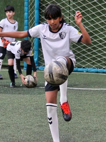 Skill and focus in action. We guide our U12 players to master advanced techniques like ball control and juggling. Each training session is a step towards realizing their potential and building a bright future in the sport.