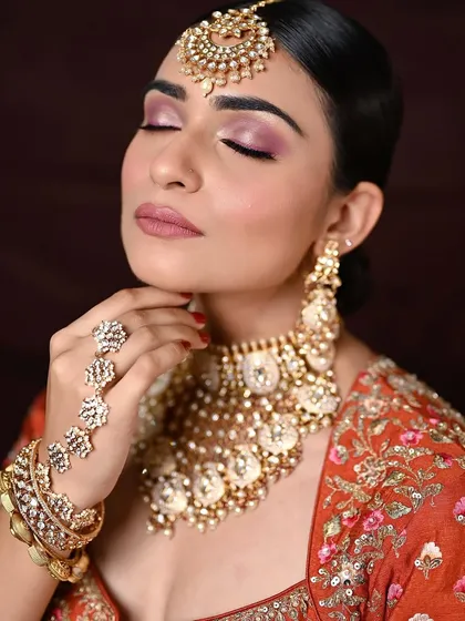 A close-up with eyes closed, focusing on the soft and romantic eyeshadow blend. This is a perfect example of subtle yet impactful bridal makeup.