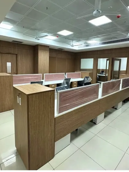 A traditional office layout with wooden cubicles and paneling for a medical institute project. This design provides a functional and professional environment for administrative work.