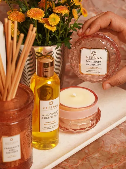 Breathe new life into your space with our Wild Violet & Bergamot collection. This image features our crystal glass candle and reed diffuser, a perfect combination to dress any corner of your home.