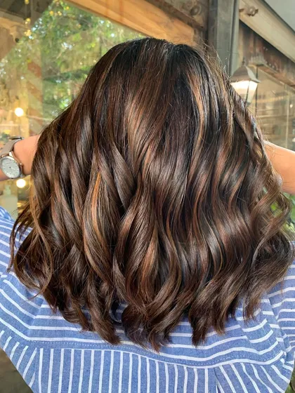 The back of this shoulder-length makeover. The non-bleach highlights add dimension and brightness to the fresh cut.