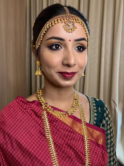 A classic muhurtham look for my bride Manasa. The combination of gold eyes and red lips is a timeless choice for a traditional Iyer wedding.