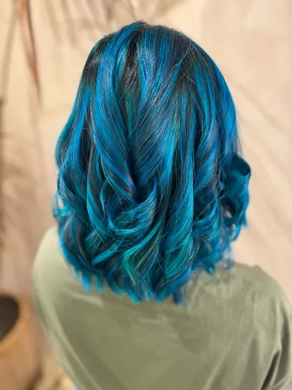 Embracing the inner mermaid with this stunning blue hair. I created this look with a mix of different blue tones on a long bob, which required bleach for that intense color payoff.