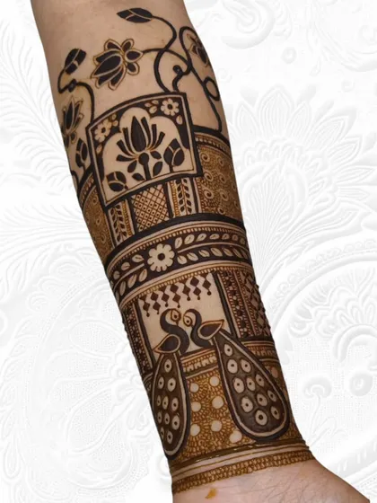 A side view of the engagement mehendi, showing the flow of the lotus vine and peacock pattern along the arm.