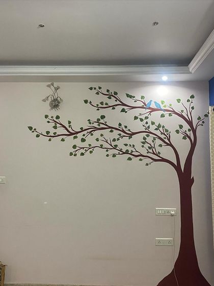A simple yet beautiful tree mural for a living room. This design brings a sense of calm and nature indoors, and the two little birds add a sweet, personal touch.