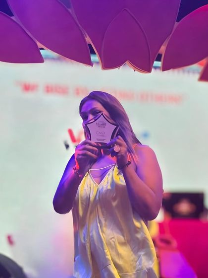 A proud moment from 2023, receiving an award at a wedding industry conference.