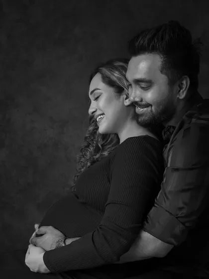 A joyful, candid moment of laughter between the couple, made even more timeless in black and white.