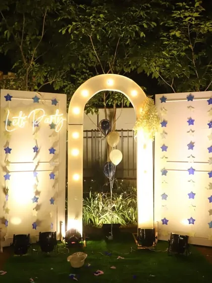 Let's get the party started. This starry night themed photobooth features a glowing arch, custom "Let's Party" neon sign, and cascading star garlands. It's a perfect backdrop for corporate anniversary parties, birthdays, or any evening celebration.