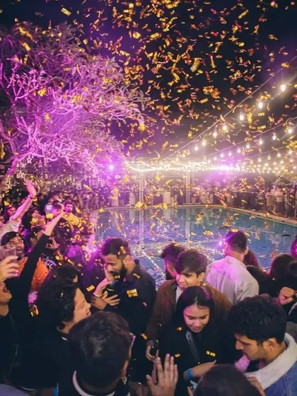 The moment the confetti drops on New Year's Eve at Taj MG Road. This picture captures the pure joy and celebration of a perfectly timed party. I specialize in creating these peak, high-energy moments for any major event.