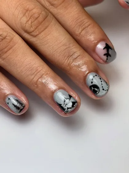 Another angle of the Switzerland-themed nails, highlighting the map, airplane, and mountain designs. This shows the cohesive storytelling across the entire manicure.
